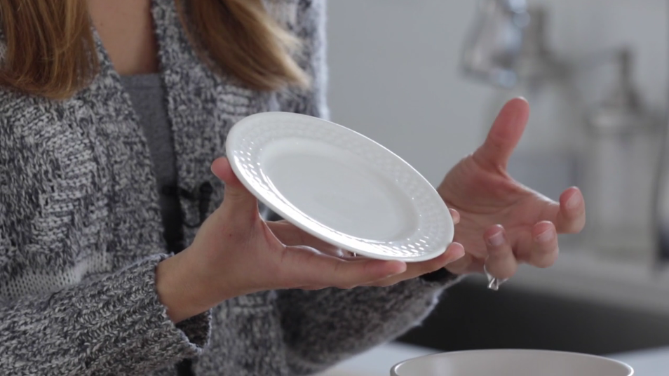 Lindsay Ostrom holding a white plate