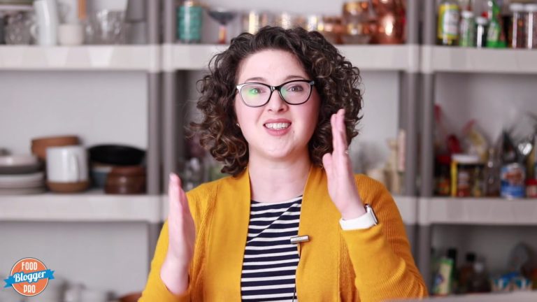 Emily Caruso speaking in front of photography props for a Food Blogger Pro course