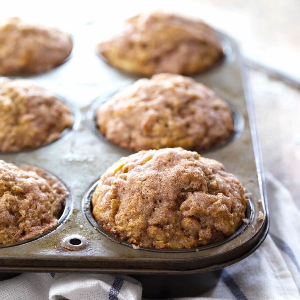 Tray of muffins on top of a tea towel