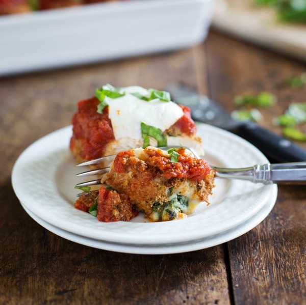 Pasta bake on two white plates shot in natural light