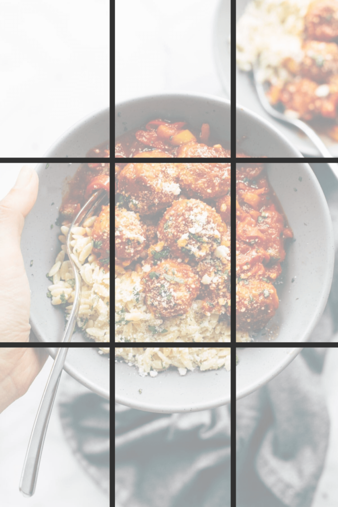 A bowl filled with pasta and meatballs photographed from overhead with lines drawn on to indicate the rule of thirds