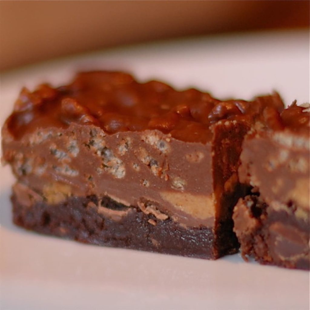 a close-up of a scotcharoo brownie on a plate