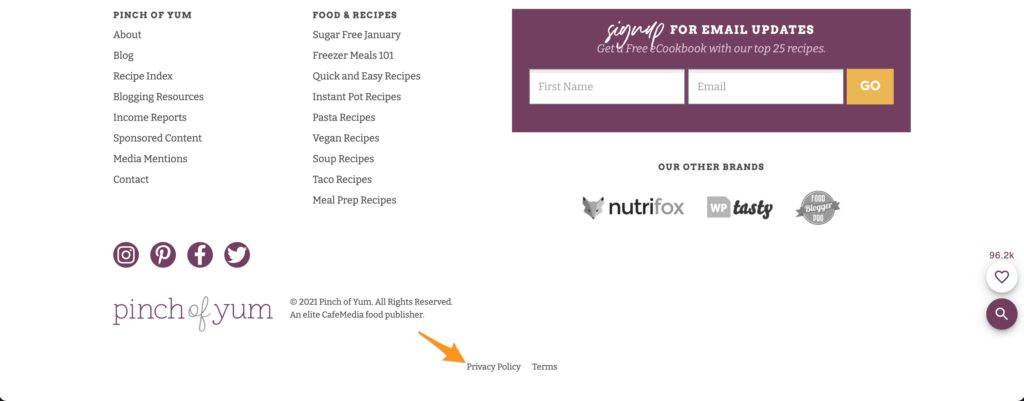 the footer of the Pinch of Yum website with an arrow pointing to the Privacy Policy link
