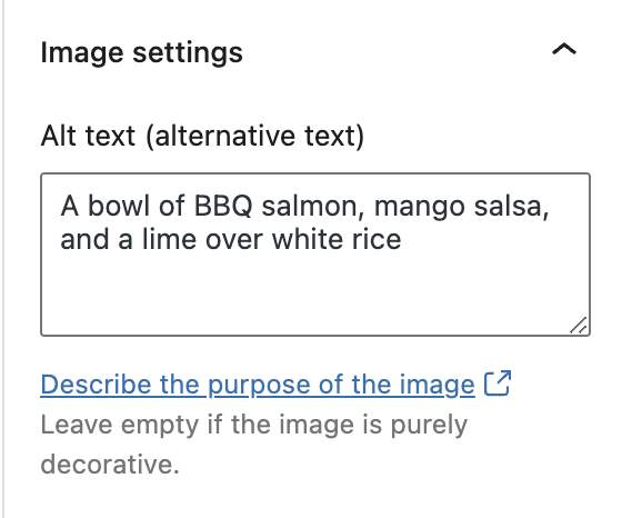 A screenshot of a WordPress alt text box that says 'Image settings, alt text, a bowl of BBQ salmon, mango salsa, and a lime over white rice.' Under the alt text is displayed 'Describe the purpose of the image, leave empty if the image is purely decorative'