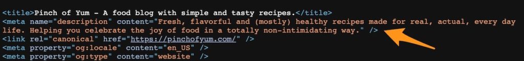 an orange arrow pointing to the meta description in the page source of the Pinch of Yum homepage