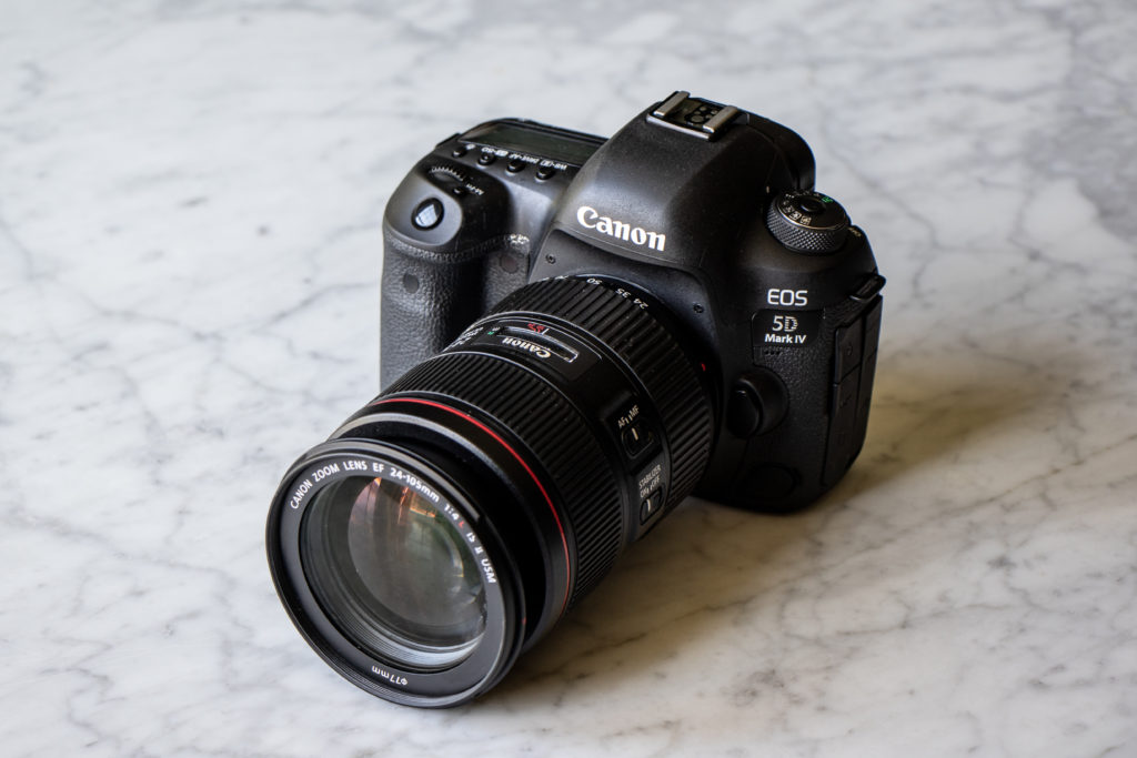 Canon 5D Mark IV with Lens on a marble background