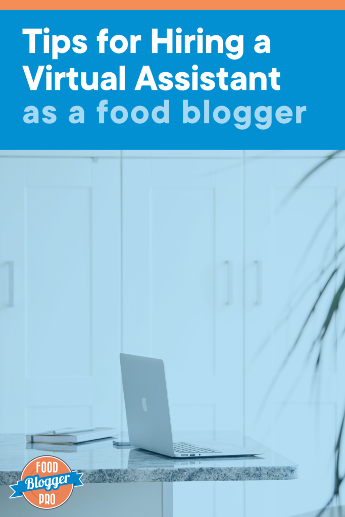 An open laptop and a notebook on a countertop with blue text that reads "Tips for Hiring a Virtual Assistant as a food blogger" with the Food Blogger Pro logo in the bottom left corner.