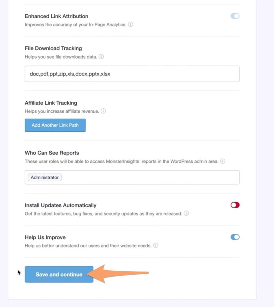 An orange arrow pointing to Save & Continue button on the MonsterInsights recommended settings page