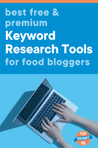 hands typing on a laptop and the title of this blog post 'best free & premium keyword research tools for food bloggers'